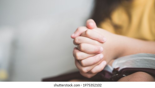 Pray Worship Online At Home.home Church Worship In Sunday Service.kid Child Girl Hand Praying And Bible Study.hope, Faith, Trust In GOD.Worship Christian Before Bible Study At Home, Close Up Hand Pray