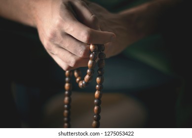 Prayer beads for meditation in men's hands. Peace and prayer. Awareness and mindfulness - Powered by Shutterstock