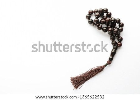 Prayer beads on white background, space for text