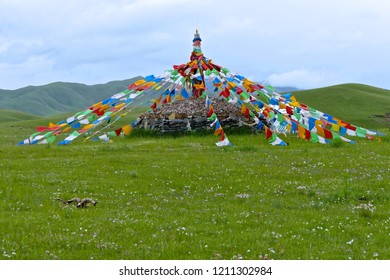 Prayer flag (colorful rectangular cloth, often found strung along mountain ridges and peaks high in the  mountain in Tibetan or Qinghai) Jinyintan (gold and silver beach ) Grassland in Qinghai