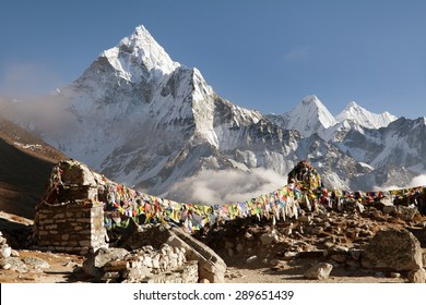 Prayer flags and mount Ama Dablam, beautiful view from Khumbu valley, Solukhumbu, way to Everest base camp - Sagarmatha national park - Nepal