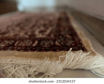 Prayer mat at a room house - Shutterstock ID 2312034137