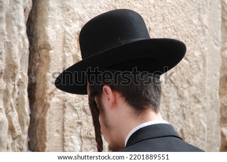 Prayer at the Western Wall Close-up, a Hasidic guy praying at the Western Wall Close-up An ultra-Orthodox Jew praying at the Western Wall A Jew praying at a relic to Solomon's Temple