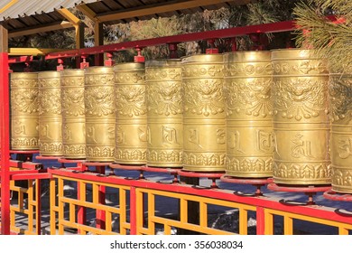 prayer wheel in a Tibetan buddhist temple, closeup of photo