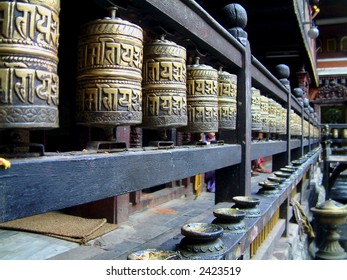 Prayer wheels at the Hiranya Verna Mahaviha temple in Patan, Nepal