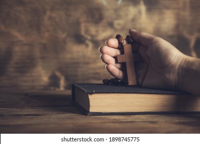 Prayer Woman Holding Cross On Bible