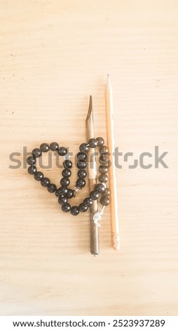 the prayers and writings things altogether on wooden table