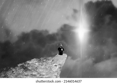 Praying Figure on the Hill before the Light in Monochrome Picture