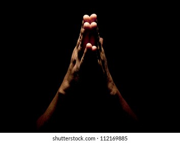 Praying Hands In Black Background