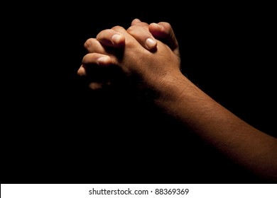 Praying Hands In Black Background