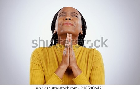Praying, hands and black woman with stress, hope and religion with faith on white studio background. African person, girl or model with anxiety, spiritual or Christian with emoji, worship or feedback