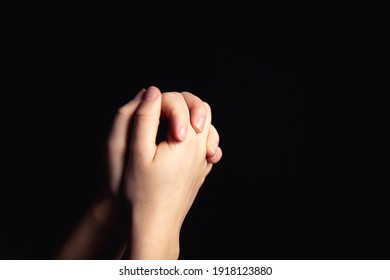 Praying hands with faith in religion and belief in God on blessing background. Power of hope or love and devotion in the dark with copy space , space for text