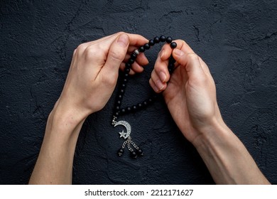 Praying Hands Hold Black Muslim Rosary With Silver Crescent Moon