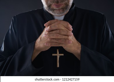 Praying hands priest portrait of male pastor - Shutterstock ID 1212427159