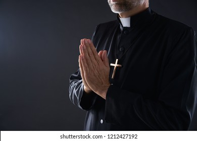 Praying hands priest portrait of male pastor