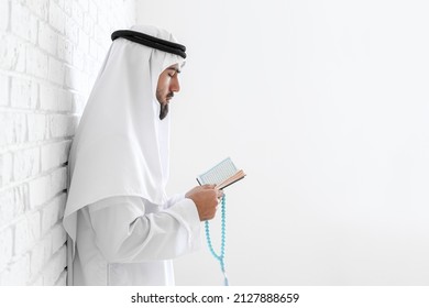 Praying Young Muslim Man At Home