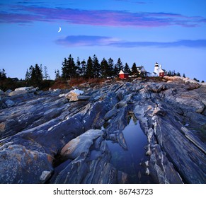 The Pre Dawn Night Is Turned To Daylight In This Time Exposure Of The Rugged Sea Coast At The Foot Of The Pemaquid Point Lighthouse, Bristol Maine, USA