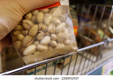 Pre Packaged Snacks Pistachios Nuts On The Shelves Of The Hypermarket. Selective Focus