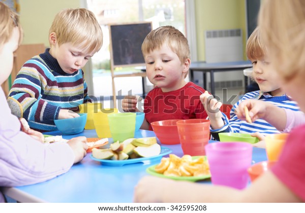 Pre School Children Eating Healthy Snacks Stock Photo (Edit Now) 342595208