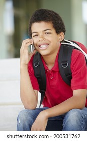 Pre Teen Boy With Phone At School