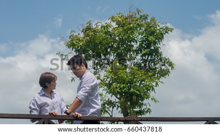 Pre wedding shooting : Lover on the bridge with big tree behind