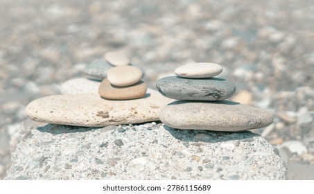 Precarious stone stack representing fragile mental equilibrium amid life turbulence.