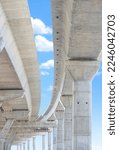 Precast Concrete Columns Structure of Elevated Expressway under Construction against blue sky in vertical frame