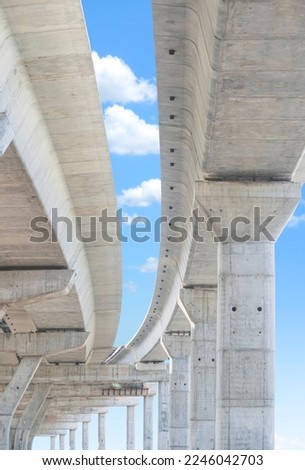 Precast Concrete Columns Structure of Elevated Expressway under Construction against blue sky in vertical frame