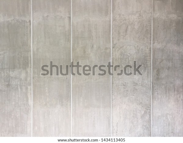 Precast concrete wall rough skimmed surface with\
white sealant joint