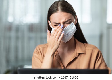 Precautions, Avoid Touching Your Eyes. Woman In Medical Mask Rubbing Her Eye Working On Laptop