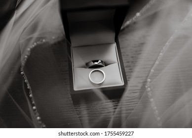 The Precious And Beautiful Engagement Silver Rings In A Black Ring Box Put On The Wedding Gown