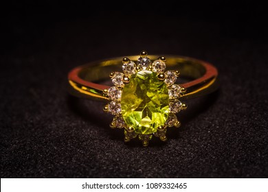 Precious golden ring with olive green stone, natural peridot.