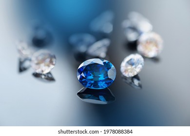precious natural blue gemstone, blue sapphire with diamond on black background