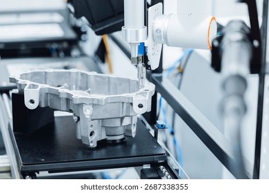 Precision cnc coordinate measuring machine analyzing engine part in high-tech manufacturing conveyor.