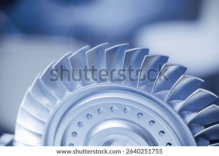 Precision cnc milling machine creating metal turbine component with detailed blades.
