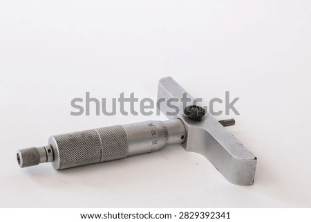 A precision depth micrometer measuring tool resting on a clean white background.