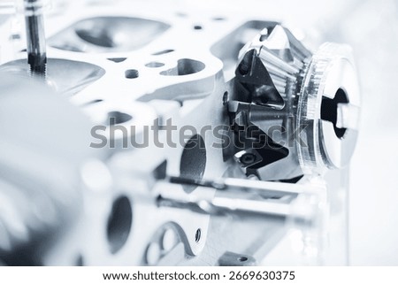 Precision engineering close-up of cnc milling machine part of engine.