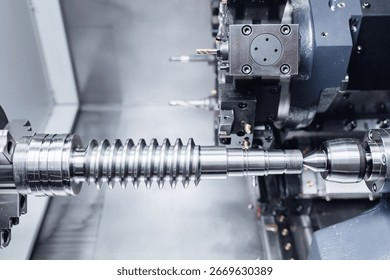 Precision engineering, cnc milling machine creating metal component detail.