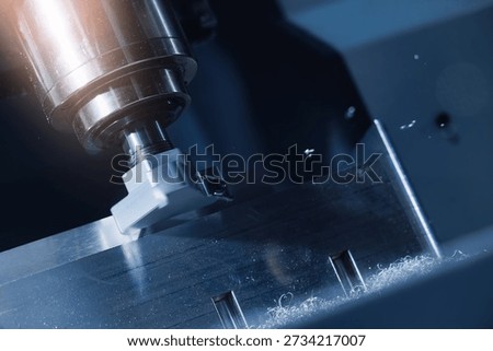 Precision engineering, cnc milling machine cutting metal with precision detail.