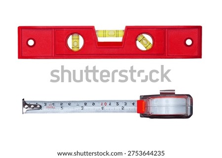 Precision measuring tools including red spirit level and retractable tape measure