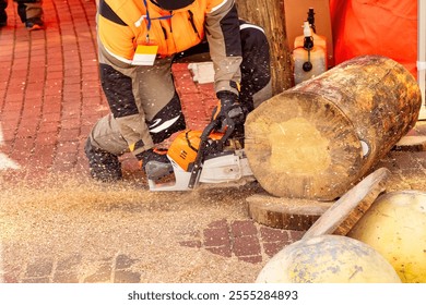 With precision and skill, a worker expertly handles a chainsaw to slice through a thick log at a vibrant lumberjack festival. - Powered by Shutterstock