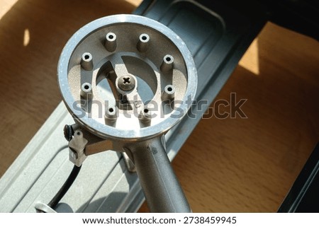 Precision tool on workbench highlights craftsmanship in sunlight