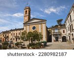 Predappio Alta, Forli Cesena, Emilia Romagna, Italy: the main square Piazza Cavour with the church and the Post office building in the old town of the ancient Italian village