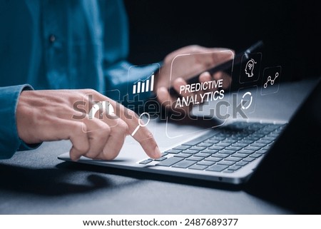 Predictive analytics. Businessman using laptop with automation and predictive modeling for useful insights and decision making.