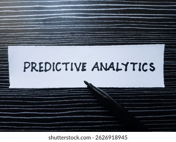 Predictive analytics writting  on table background.