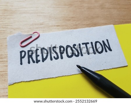 Predisposition writting on table background.