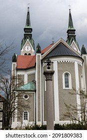 Predjama, Slovenia - 04 09 2018: Facade Of A Catholic Church With Dark Clouds In The Background