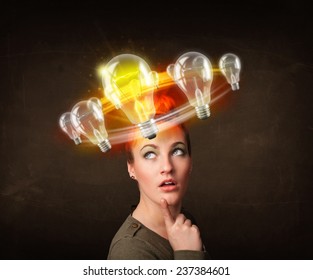 Preety woman with light bulbs circleing around her head  - Shutterstock ID 237384601