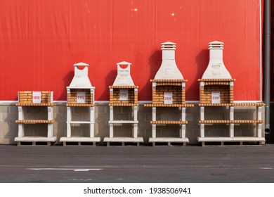 Prefabricated Barbecues With Fireplace, Exposed In The Outside Entrance And Parking Area Of A Giant Warehouse Supermarket, On The Outskirts Of Zaragoza City, Spain.