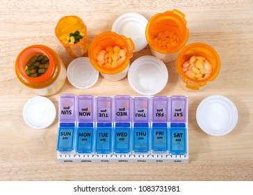 Pre-filling Twice A Day Medication Box With Many Pills. The Importance Of Medication Management Cannot Be Overstated, Especially When It Comes To The Care Of Seniors. Med Boxes Assist With Management.